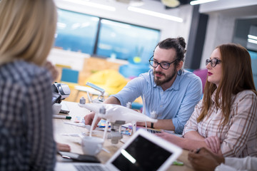 multiethnic business team learning about drone technology
