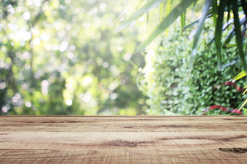 Wooden empty and blurred fresh green nature garden background.