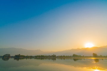 Naklejka na ściany i meble Sunrise on Dal lake, Kashmir India .