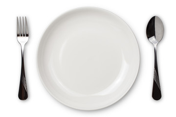 Dinner place setting. A white plate with silver fork and spoon isolated on white background. View from above.