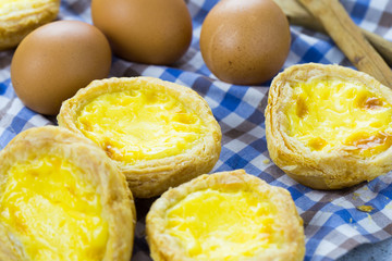 typical Portuguese egg tart pastries from Lisbon on a set table