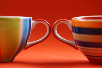 Cup of coffee closeup on orange texture blur background