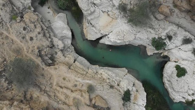 aerial of canyon in oman with river