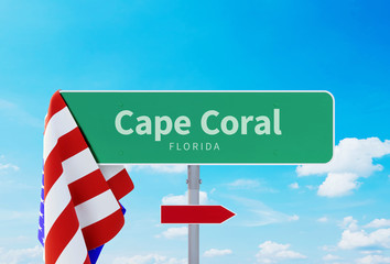Cape Coral – Florida. Road or Town Sign. Flag of the united states. Blue Sky. Red arrow shows the direction in the city