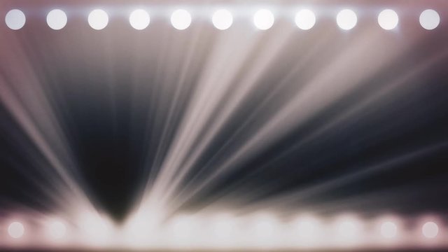 Abstract shining spotlights with white beams of light, monochrome background, seamless loop. Animation. Glowing soffits on black background, stage lighting concept.