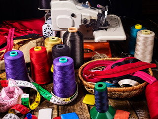 Serger or overlock in seamstress with group sew object sewing spool on black background. Learning...