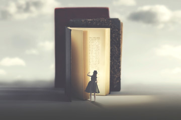 curious woman looks into a mysterious illuminated book