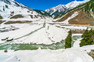 Beautiful  River and snow covered mountains landscape Kashmir state, India .