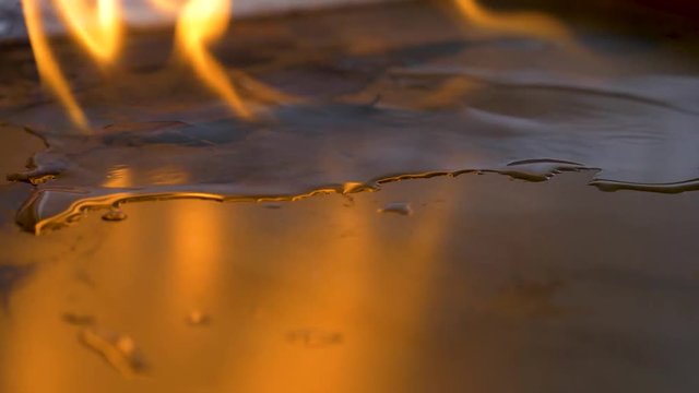 alcohol on fire evaporating right. in front of you