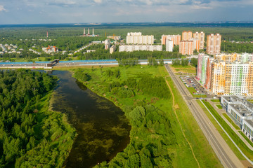Fototapeta premium MOSCOW, RUSSIA - MAY 26, 2019: Top view of the new colorful residential area of Moscow on a summer evening