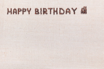The words Happy Birthday written with coffee beans , aligned at the top left.