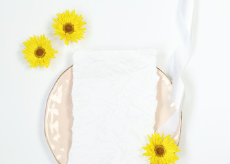 Mockup invitation card on pink plate with yellow flowers 