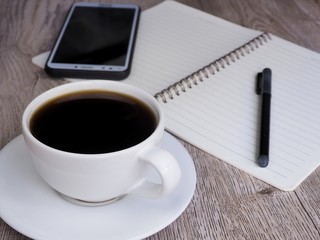Obraz na płótnie Canvas cup of coffee and book