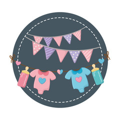 round frame with baby clothes