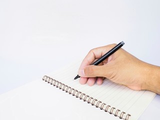 hand with pen and notebook isolated on white background