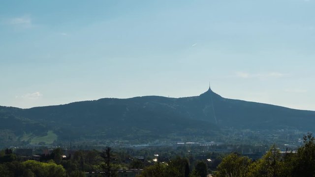 Timelapse of Liberec city in Czech Republic with Jested tower in a background, zoom landscape view