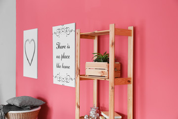 Wooden rack near color wall in interior of room