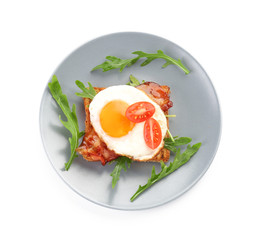 Plate with grilled bread, fried egg and bacon on white background