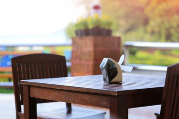 Wooden table and chairs in outdoor closeup