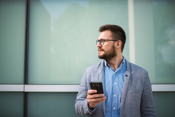 Side view of businessman using smartphone