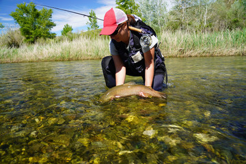 woman fishing in the river