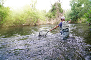 fly fisherman in the river