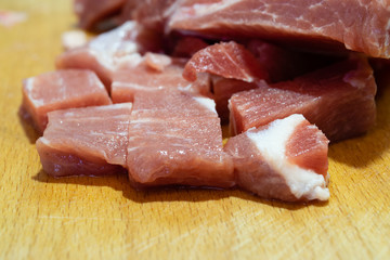 Pork meat close-up on a cutting board with a small amount of fat