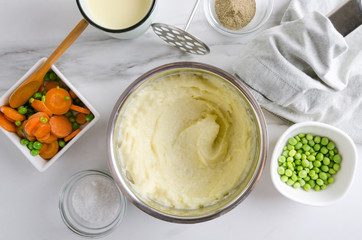 Top view of tasty vegetarian mashed potatoes with vegetables.Process of cooking