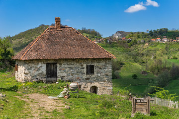 Fototapeta na wymiar Serbian household on the mountain. Village old house. Beautiful nature in Serbia.