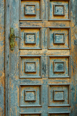 vintage wooden door and old white wall as background