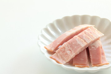 chopped bacon on white dish for food ingredient image