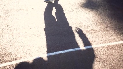 Dribbling basketball player on the court with the ball  slow motion . - Powered by Adobe