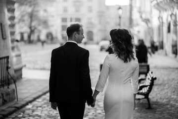 Bride and Groom on Wedding Day in city.