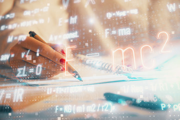 Science formula hologram over woman's hands taking notes background. Concept of study. Multi...