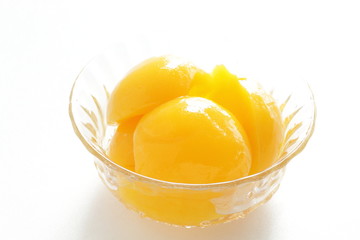 peach on bowl with copy space