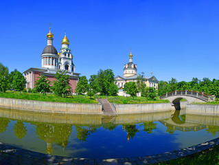 The church, the pond and the bridge are part of the Old Believer Center, formed in the 18th century on the site of the Rogozhskaya settlement. Russia, Moscow, May 2019.