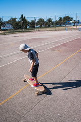 young boy playing with a skateboard