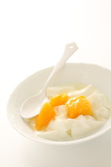 Peach and yogurt on bowl