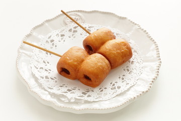 Corn dog on dish with copy space