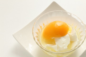 Chinese dessert, peach and almond tofu on glass bowl