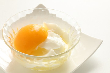 Chinese dessert, peach and almond tofu on glass bowl