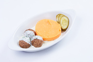 meatballs with mashed potato on the white