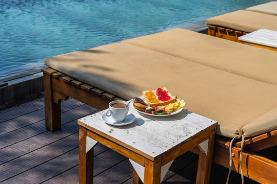 Enjoy breakfast at the swimming pool in resort hotel