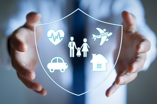 Businessman with protective gesture and family, life, car, travel, health and house insurance icons. Insurance concept.
