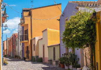 Colorful houses and narrow alleys in Bosa, province of Oristano, a picturesque village of ancient origins, Sardinia, Italy.
