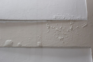 House peeling paint from rain and water leak building problem concept background.