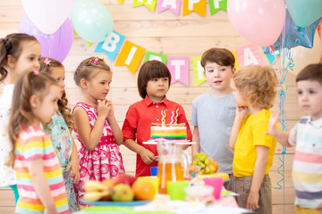 Group of children celebrate birthday party together