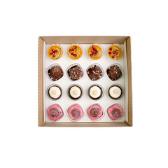 Collection of take away kraft boxes with  different desserts on white background, top view.