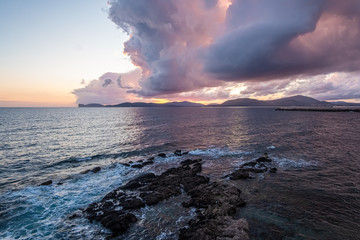 Sunset/Dusk along the sea front of Alghero (L'Alguer), province of Sassari , Sardinia, Italy. ...