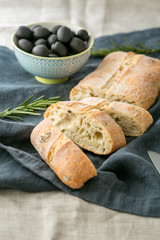 Freshly baked traditional italian bread ciabatta with olives